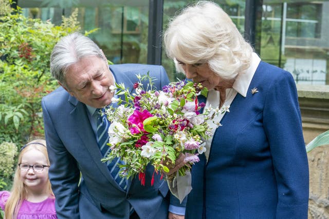 The Queen Camilla is welcomed by Alan Titchmarsh during a visit to the Gardening Bohemia exhibition at the Garden Museum, in Lambeth, south London (Arthur Edwards/The Sun/PA)