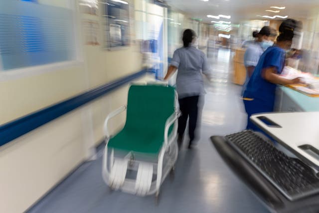 Staff on an NHS hospital ward at Ealing Hospital (PA)