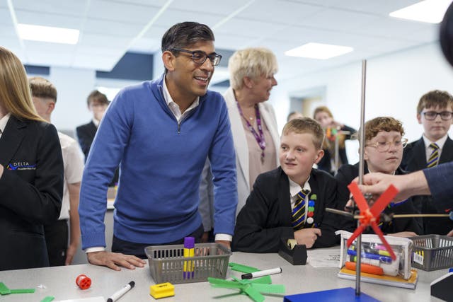 Rishi Sunak speaking to pupils during a science lesson at John Whitgift Academy, Grimsby (Dominic Lipinski/PA)