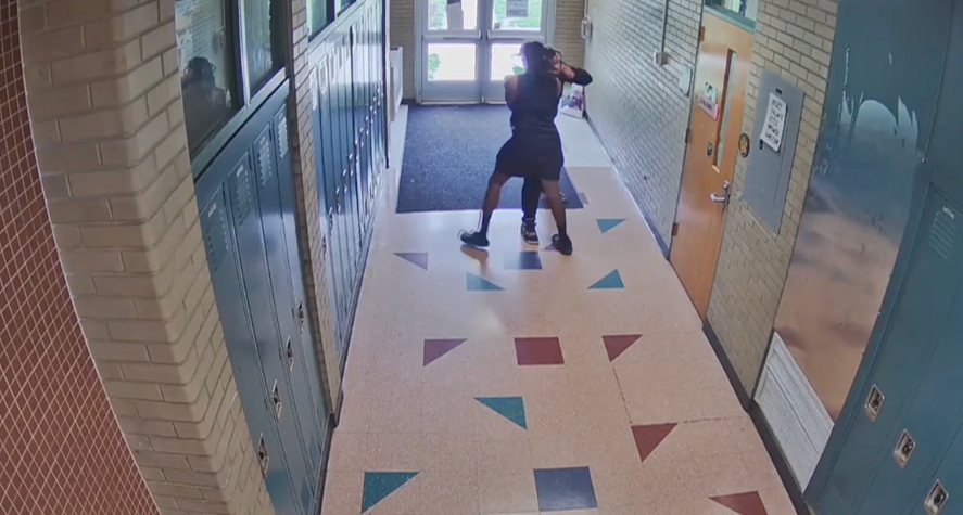 A former coach at Ypsilanti Middle School in Michigan is seen on surveillance video from June 4, 2024, allegedly choking a student with a shirt.