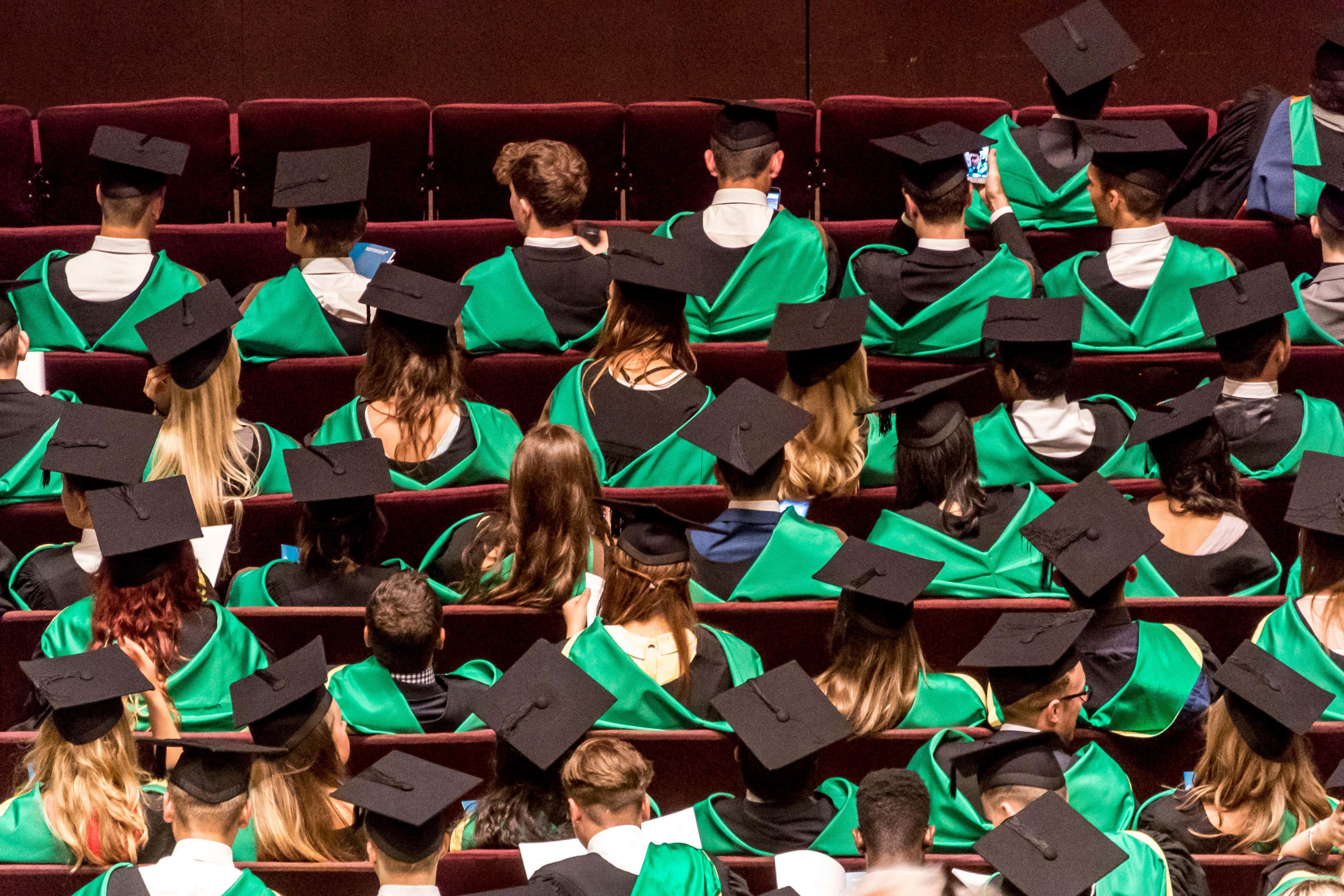 Students are taking on more paid work alongside their studies, a report found (Alamy/PA)