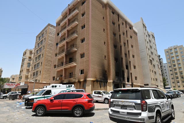 <p>An exterior view a residential building after a fire broke out in Mangaf area, southern Ahmadi governorate, Kuwait</p>