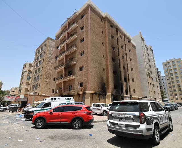 <p>An exterior view a residential building after a fire broke out in Mangaf area, southern Ahmadi governorate, Kuwait</p>