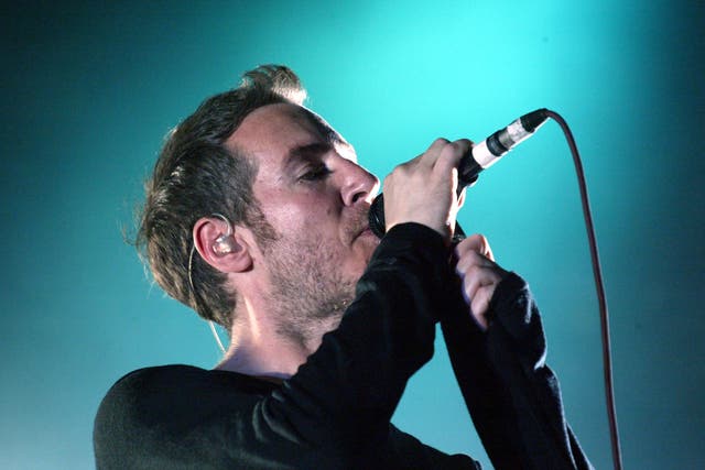 <p>Robert Del Naja of the British group Massive Attack performs to a crowd of approximately 10,000 at Queens Square on 25 August, 2003 in Bristol</p>