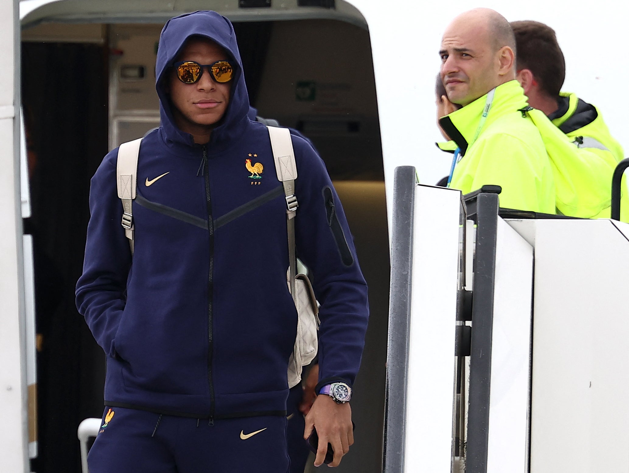 Kylian Mbappe disembarks as he arrives at the airport in Paderborn Lippstadt