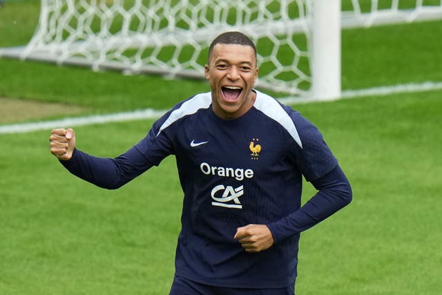 <p>France’s Kylian Mbappe gestures during a training session in Paderborn</p>