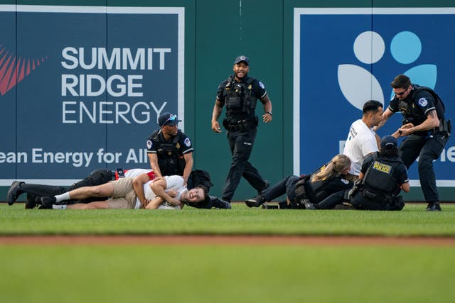 <p>Eight climate protestors stormed Wednesday’s annual Congressional Baseball Game </p>
