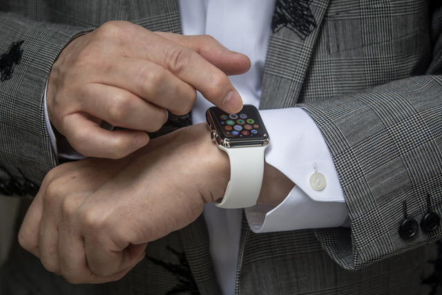 <p>Hajime Shimada shows off his newly purchased Apple Watch outside boutique store, Dover Street Market Ginza on 24 April, 2015 in Tokyo, Japan</p>