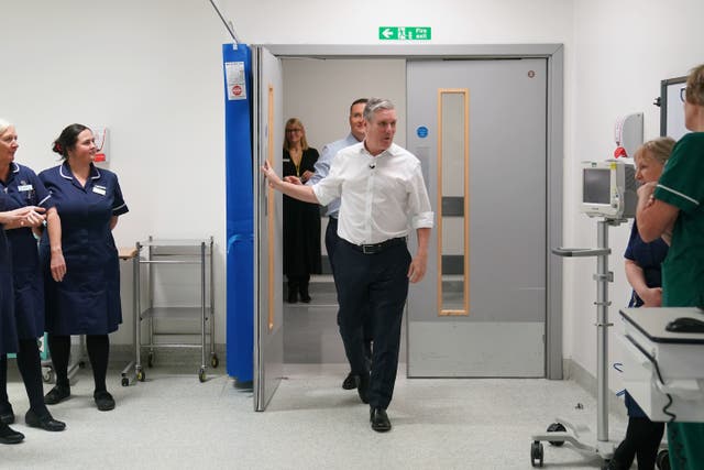 Labour leader Sir Keir Starmer and shadow health secretary Wes Streeting meet staff during a hospital visit (Joe Giddens/PA)