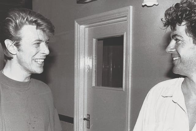 <p>Alan Edwards (right) with David Bowie</p>