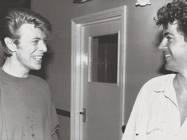 <p>Alan Edwards (right) with David Bowie</p>