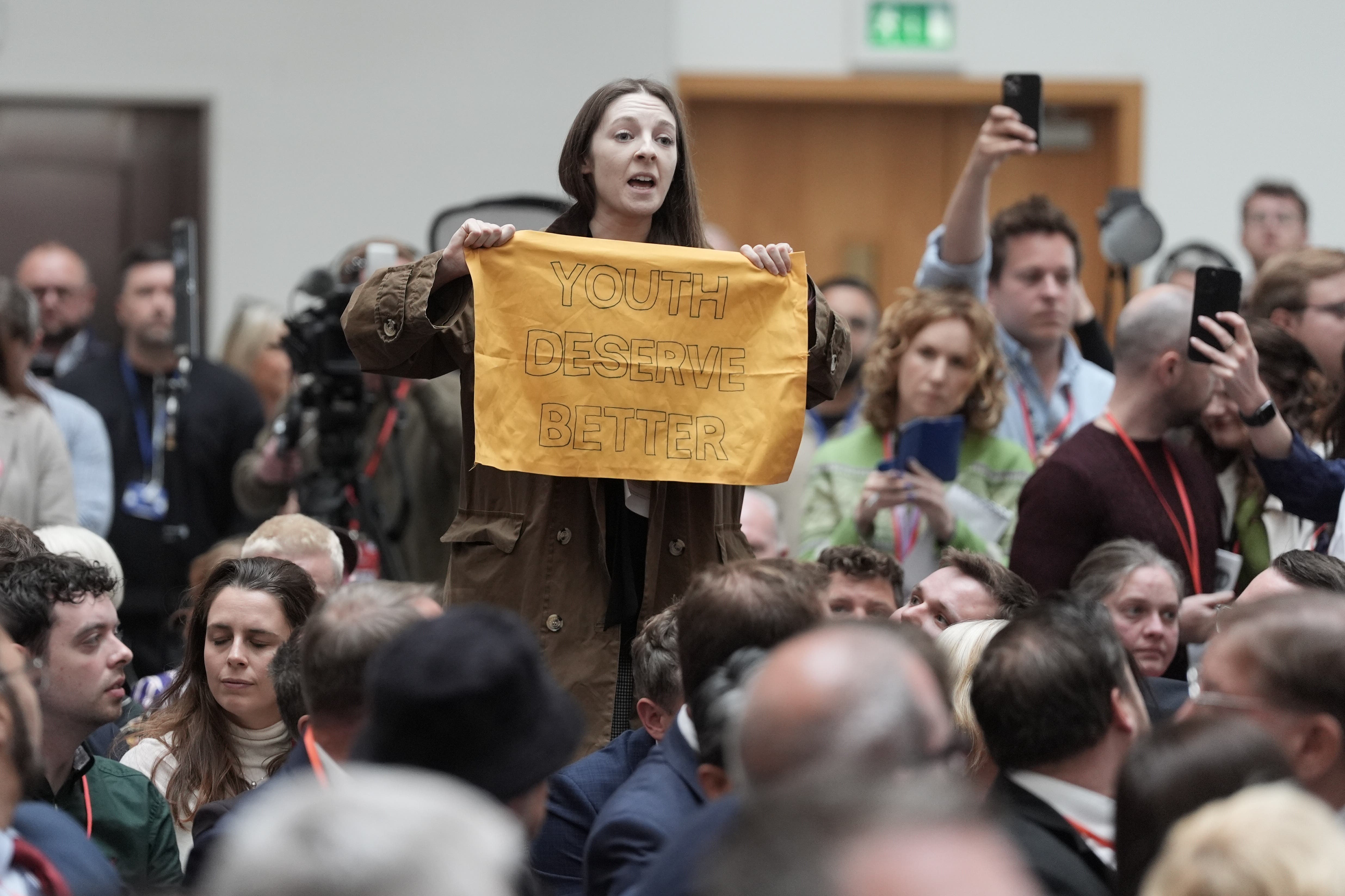 A woman heckles Labour leader Sir Keir Starmer during his party’s manifesto launch at Co-op HQ in Manchester (Stefan Rousseau/PA)