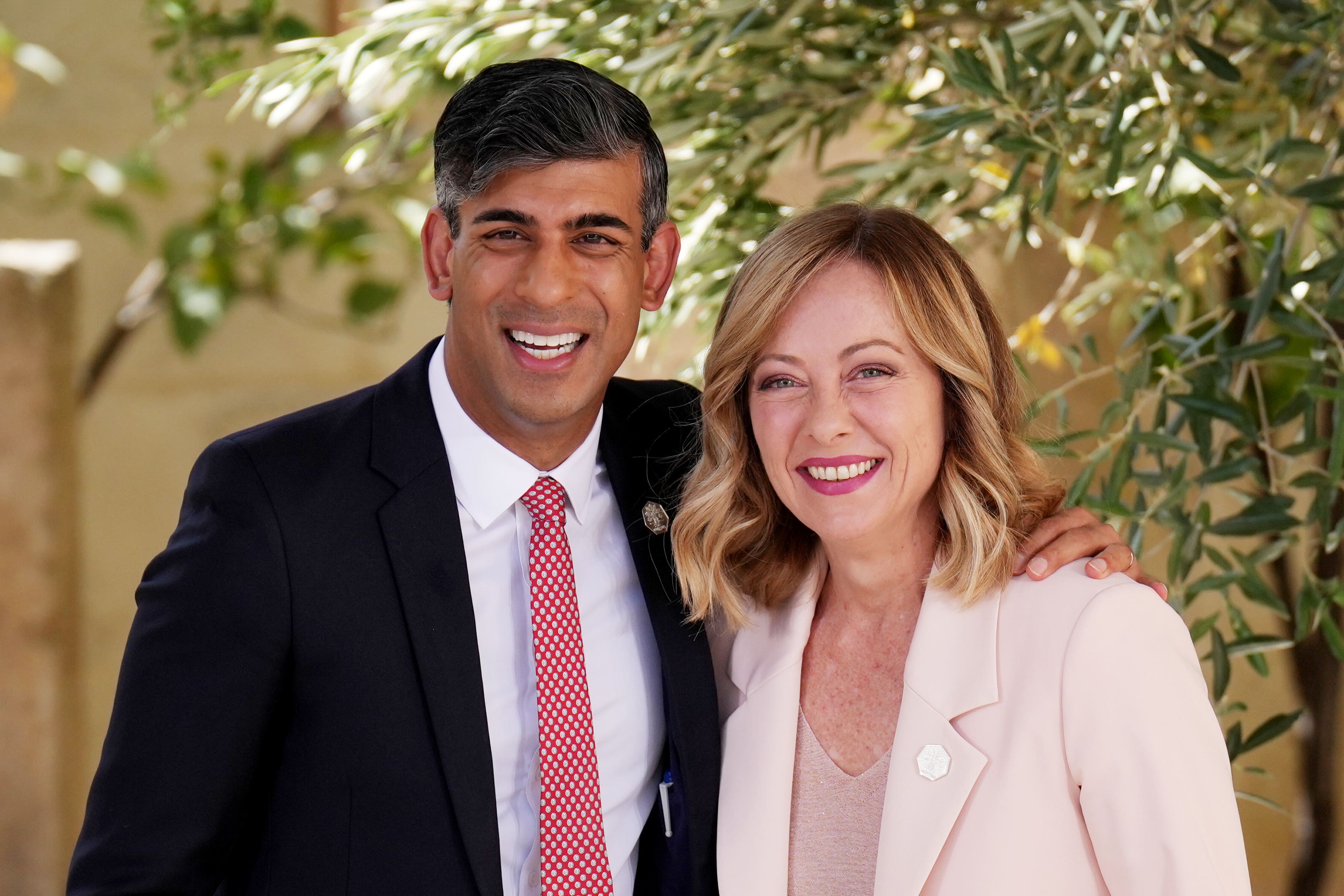 Rishi Sunak is greeted by Italian Prime Minister Giorgia Meloni during a welcome ceremony at the G7 summit in Puglia (Christopher Furlong/PA)