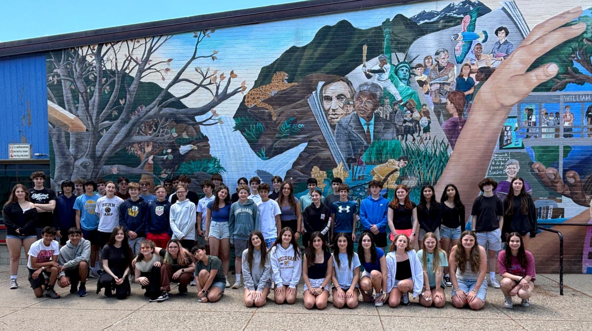 Double take: 23 sets of twins graduate from a single Massachusetts middle school