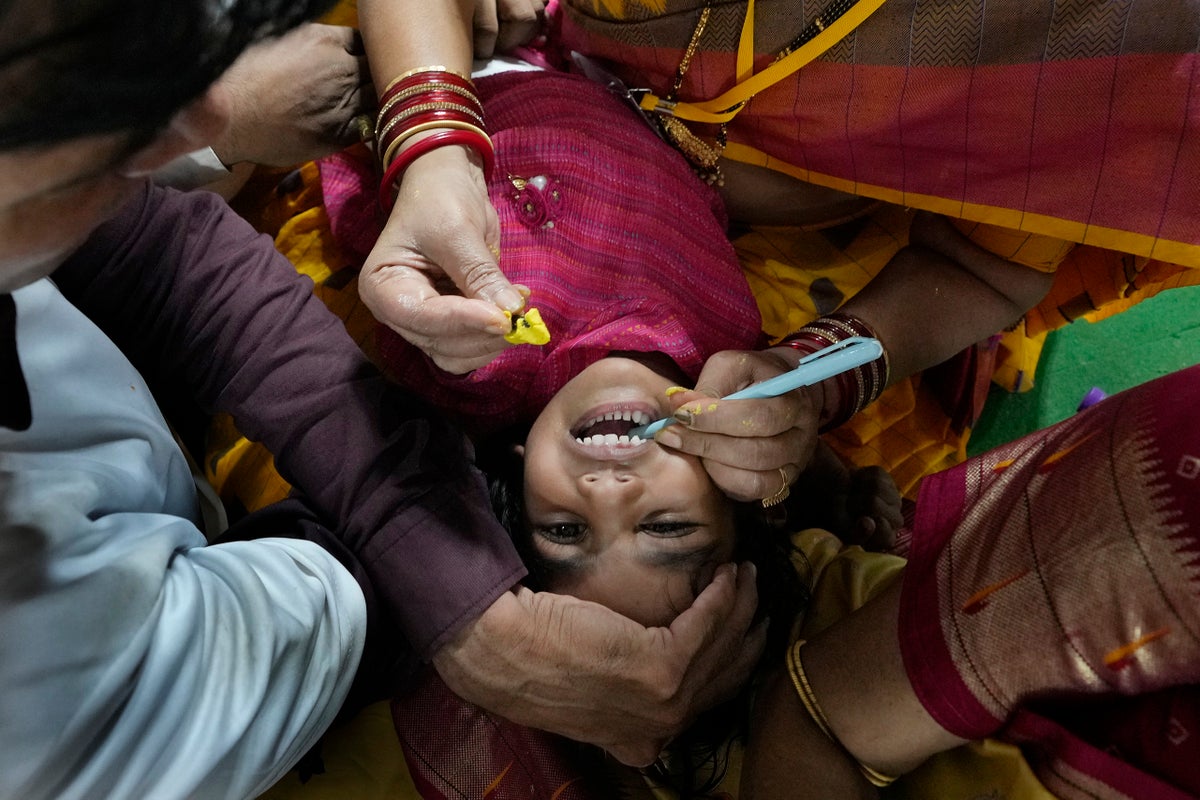 AP PHOTOS: Myriad people flock to Indian city to swallow live fish with ‘miracle cure’ to asthma