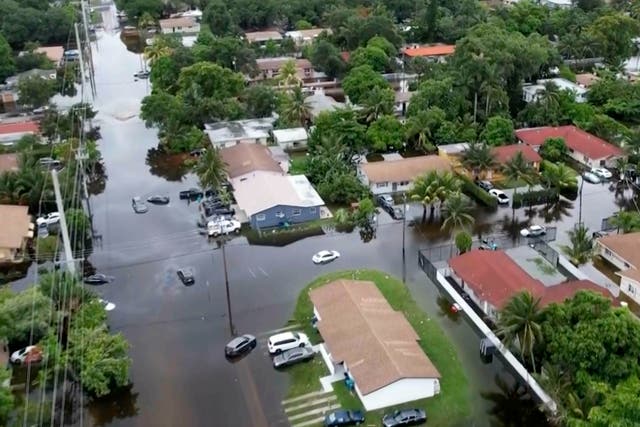 <p>This aerial view taken from video shows a flooded street in Northeast Miami-Dade County, Florida</p>