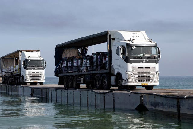 <p>Humanitarian aid being trucked into Gaza </p>