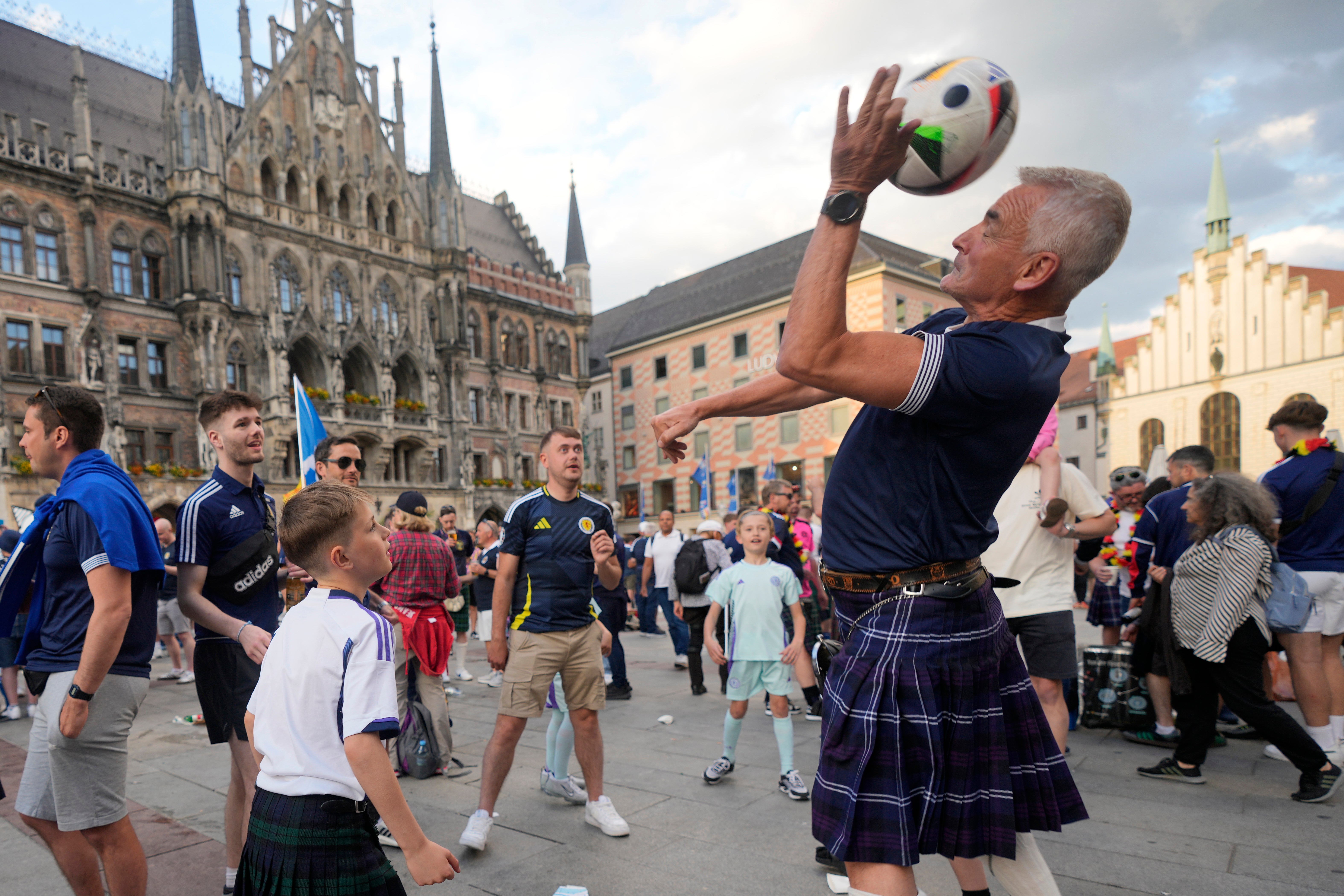 Scotland's soccer fans party at Marienplatz square next to the town hall