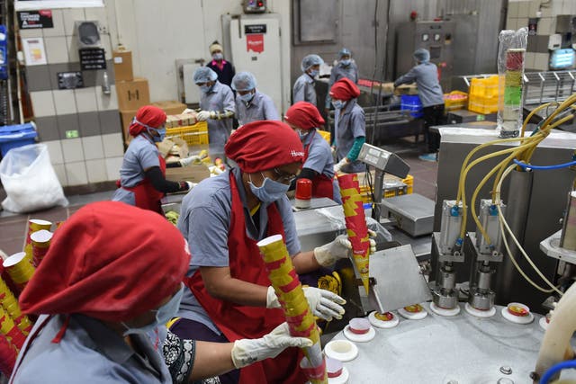 <p>For representational purposes only. Indian factory workers prepare ice cream cones on an assembly line at an ice cream plant in Naroda, near Ahmedabad, Gujarat</p>