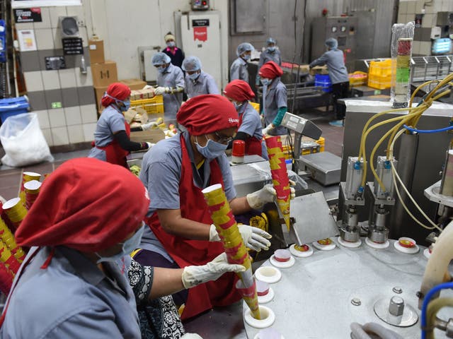 <p>For representational purposes only. Indian factory workers prepare ice cream cones on an assembly line at an ice cream plant in Naroda, near Ahmedabad, Gujarat</p>