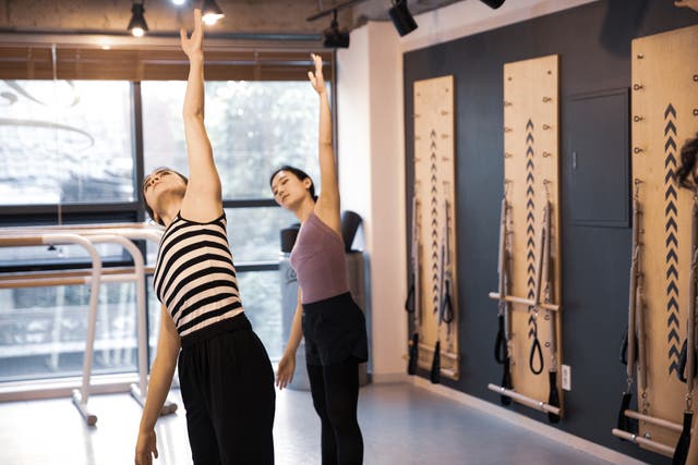 <p>Women work out in a South Korean studio</p>