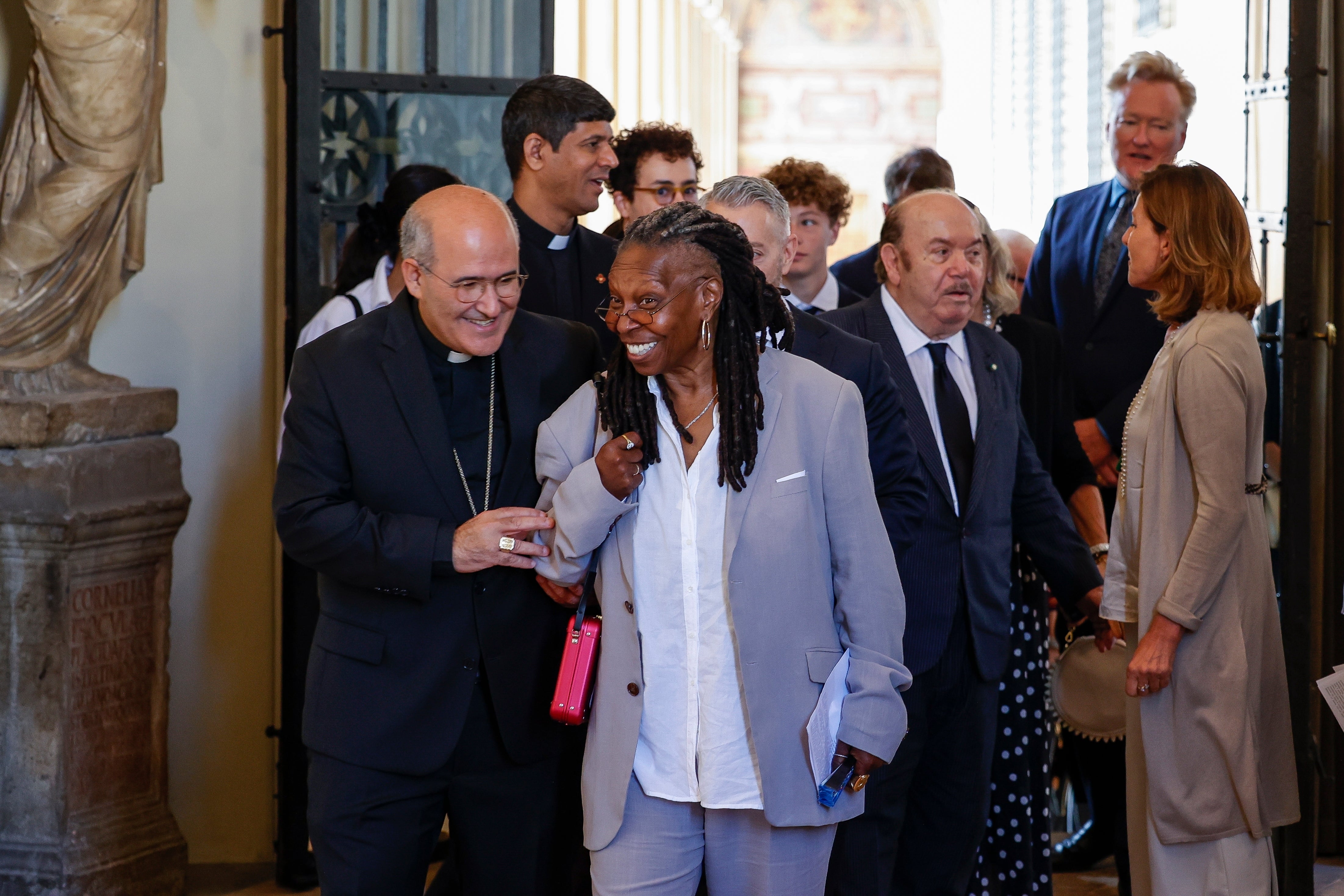 Whoopi Goldberg, centre, leaves after an audience with Pope Francis in Clementine Hall