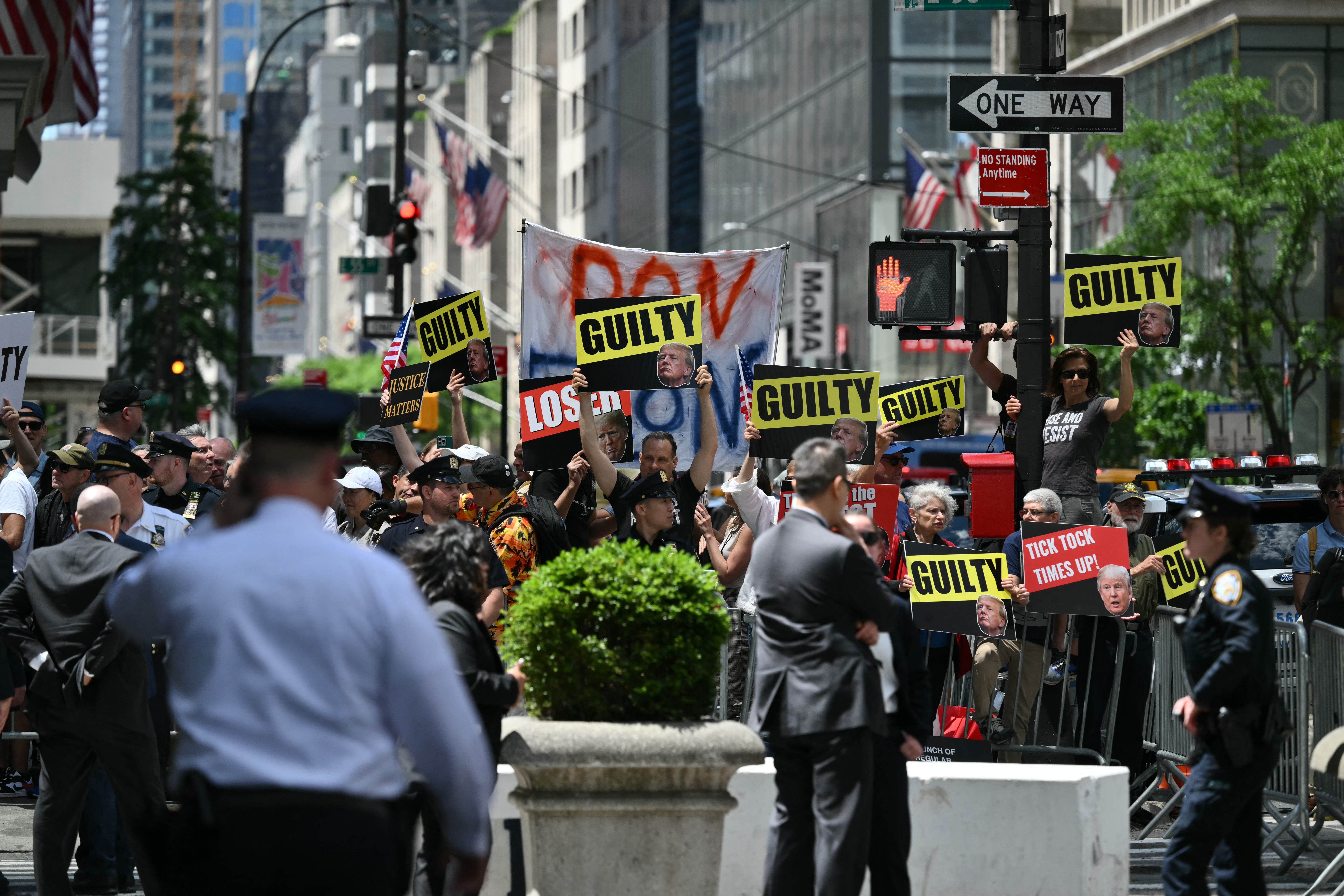 Anti-Trump demonstrators protest outside Trump Tower in New York on May 31.