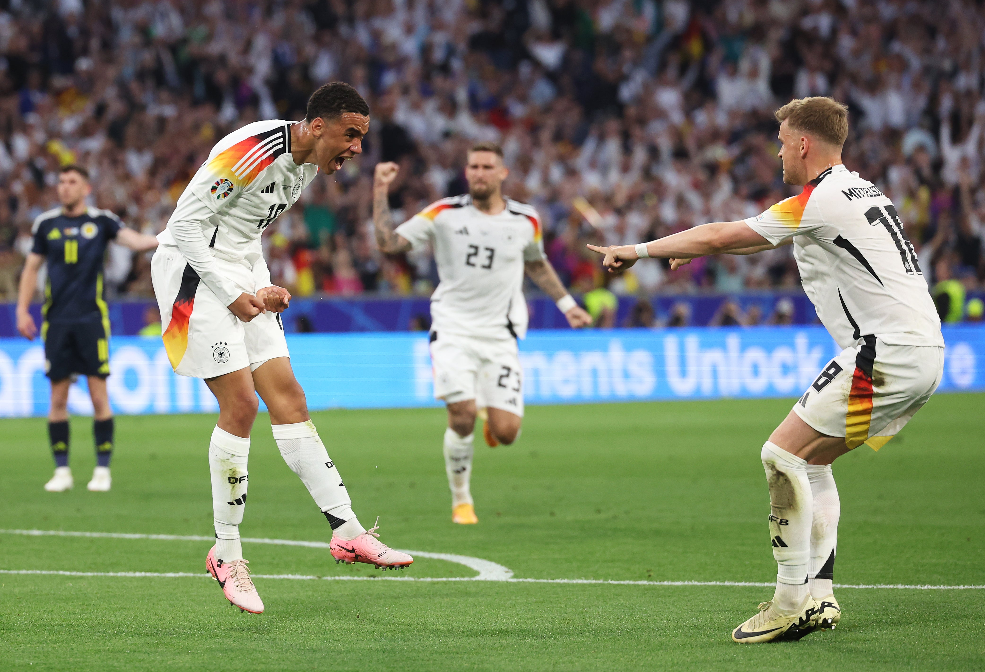 Jamal Musiala, left, celebrates after scoring Germany’s second goal
