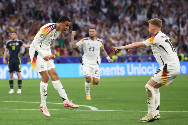 <p>Jamal Musiala, left, celebrates after scoring Germany’s second goal</p>