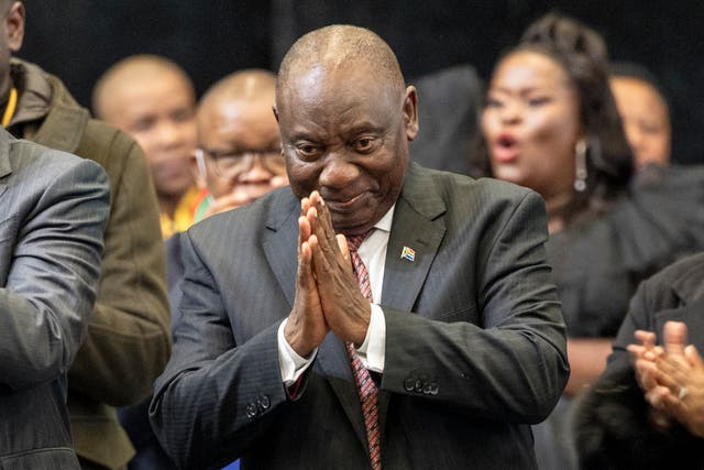 <p>President of the African National Congress (ANC) Cyril Ramaphosa (C) gestures after he was announced president during the first sitting of the New South African Parliament in Cape Town</p>