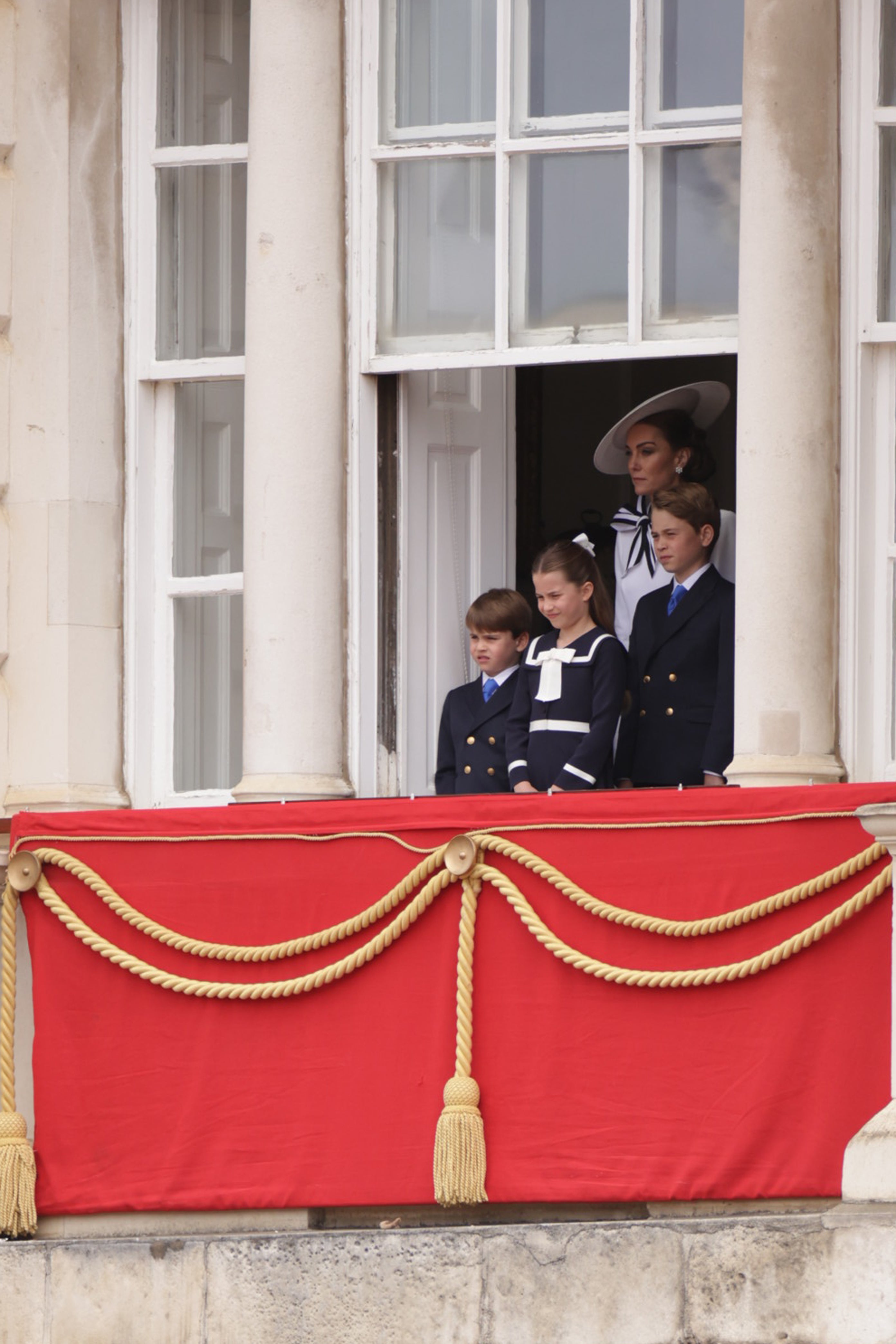 Kate watched the ceremony with her three children from a window at Horse Guards Parade
