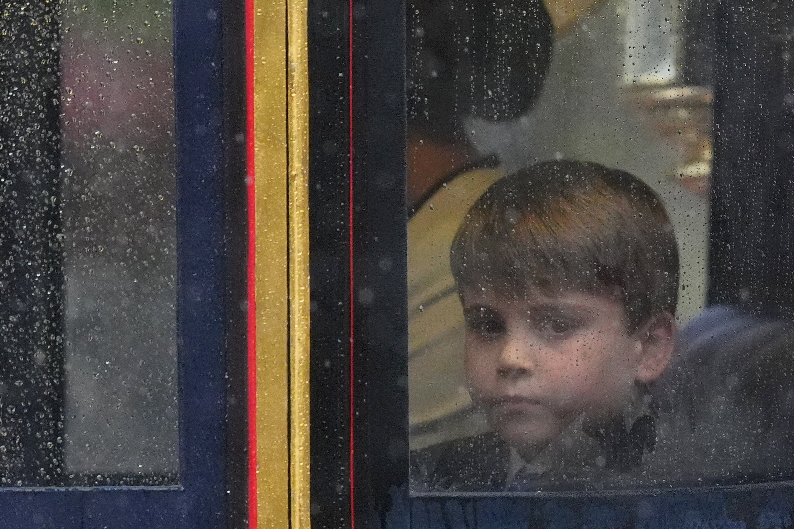 The youngest son of Kate and William looked glum when it started to rain