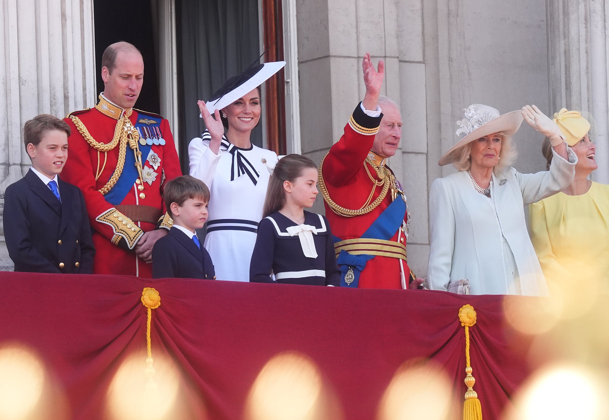 The royals wave at the crowds