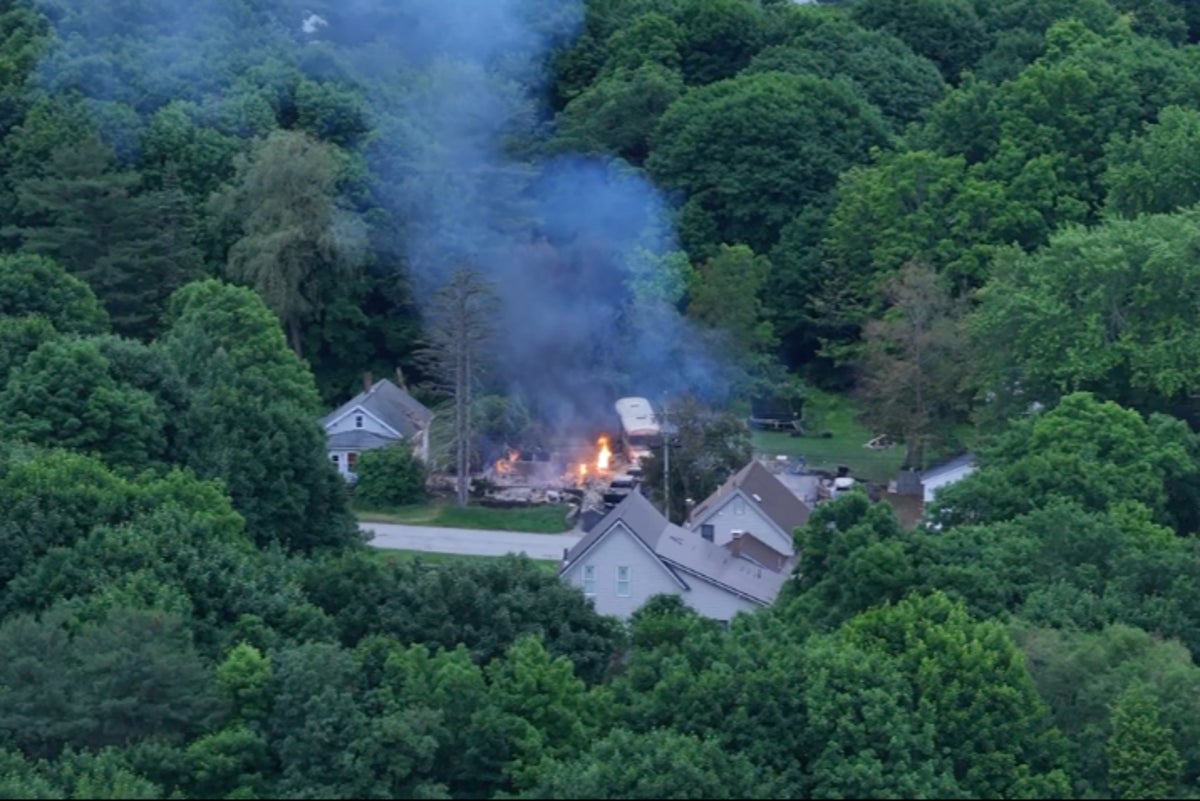 Public warned to avoid area after police standoff with gunman at burning home in Maine