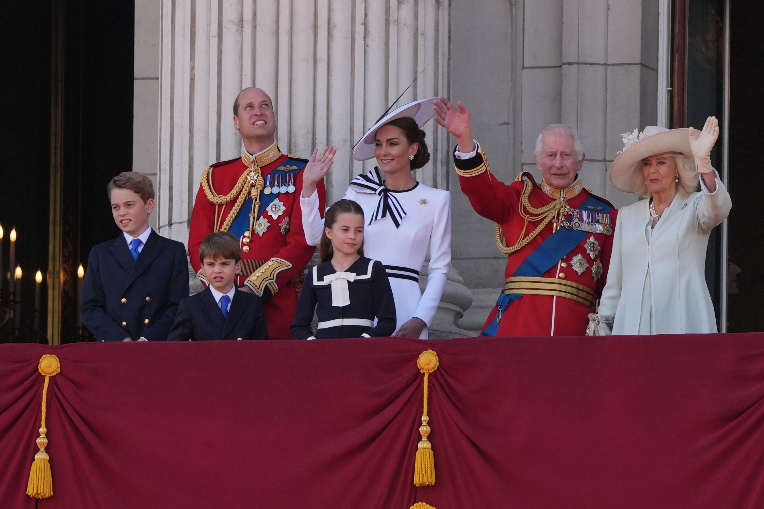 The Prince and Princess of Wales with their children, Prince George, Prince Louis, and Princess Charlotte, and King Charles III and Queen Camilla, on the balcony of Buckingham Palace.