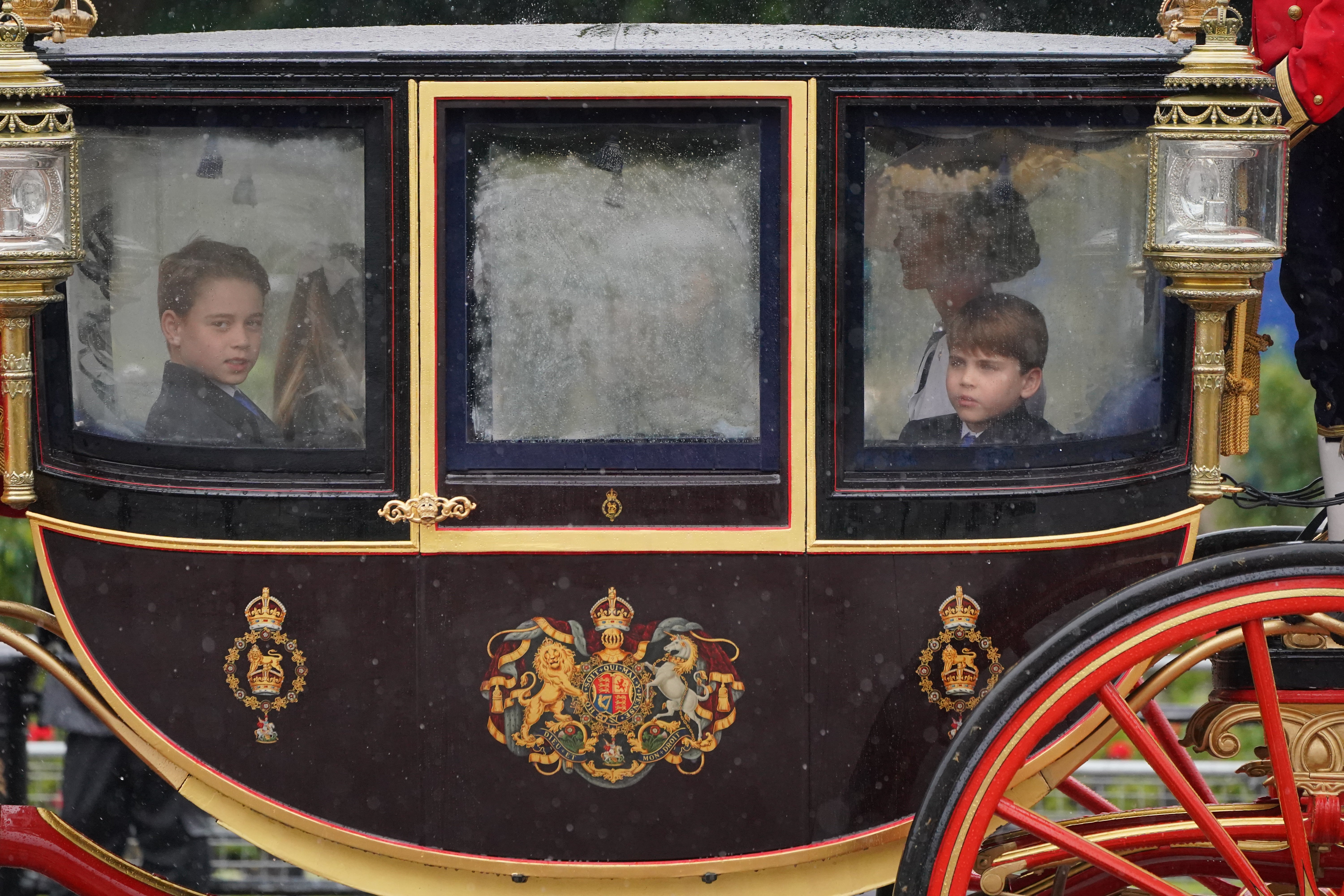 Princes wipe the fog out of the carriage windows