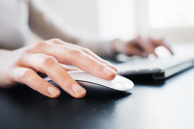 <p>Close-up of female hand with computer mouse</p>