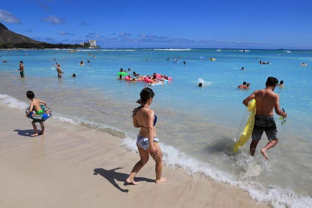 <p>Beachgoers walk on Waikiki Beach, Thursday, June 23, 2022, in Honolulu. </p>