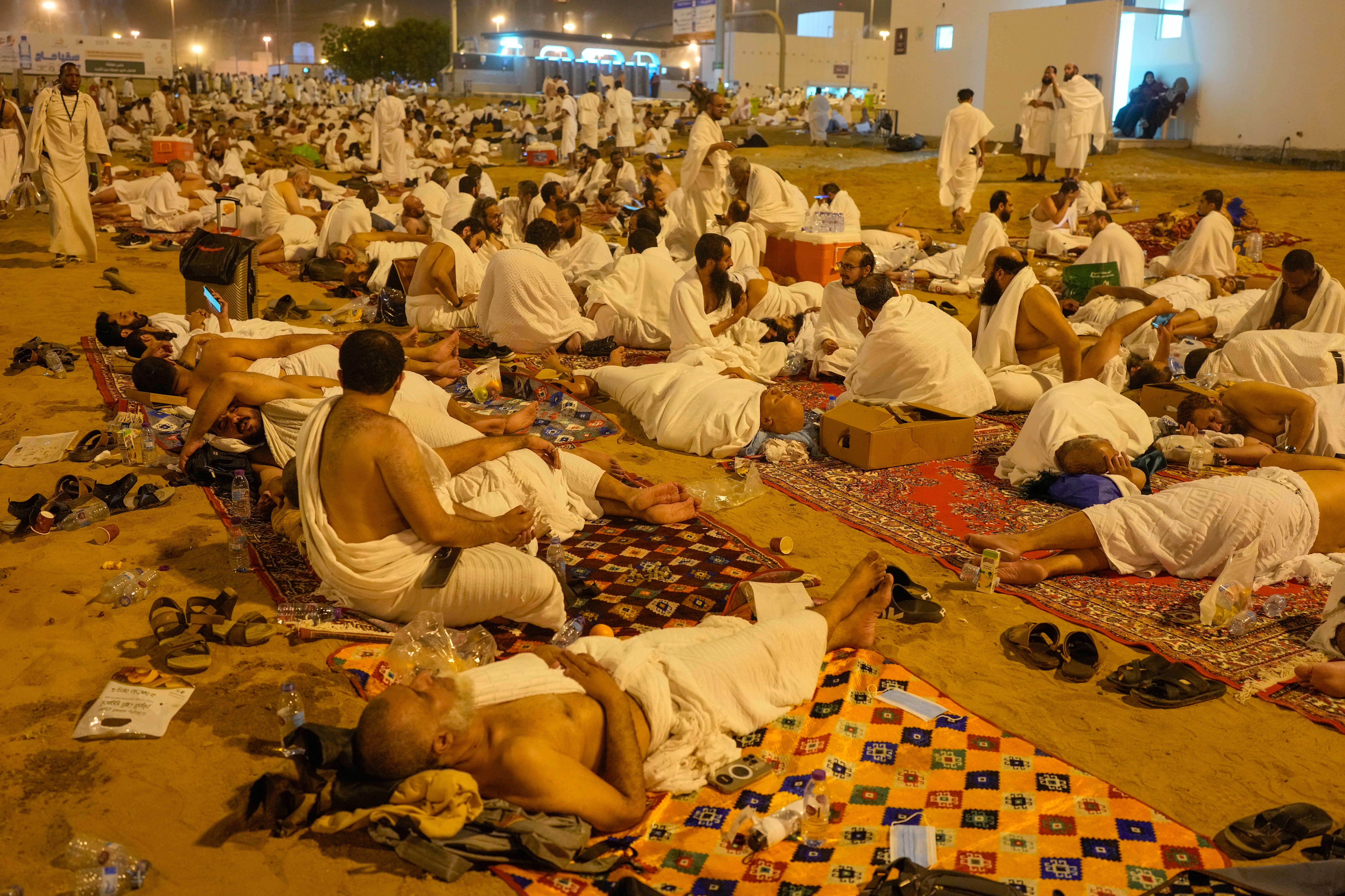 Muslim pilgrims rest in Muzdalifah, on the second day of the annual hajj pilgrimage, near the holy city of Mecca, Saudi Arabia, Saturday, 15 June 2024
