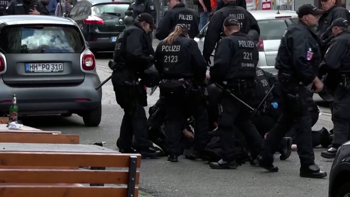 Moment police apprehend man with ‘pickaxe’ near Euros fan park in Hamburg