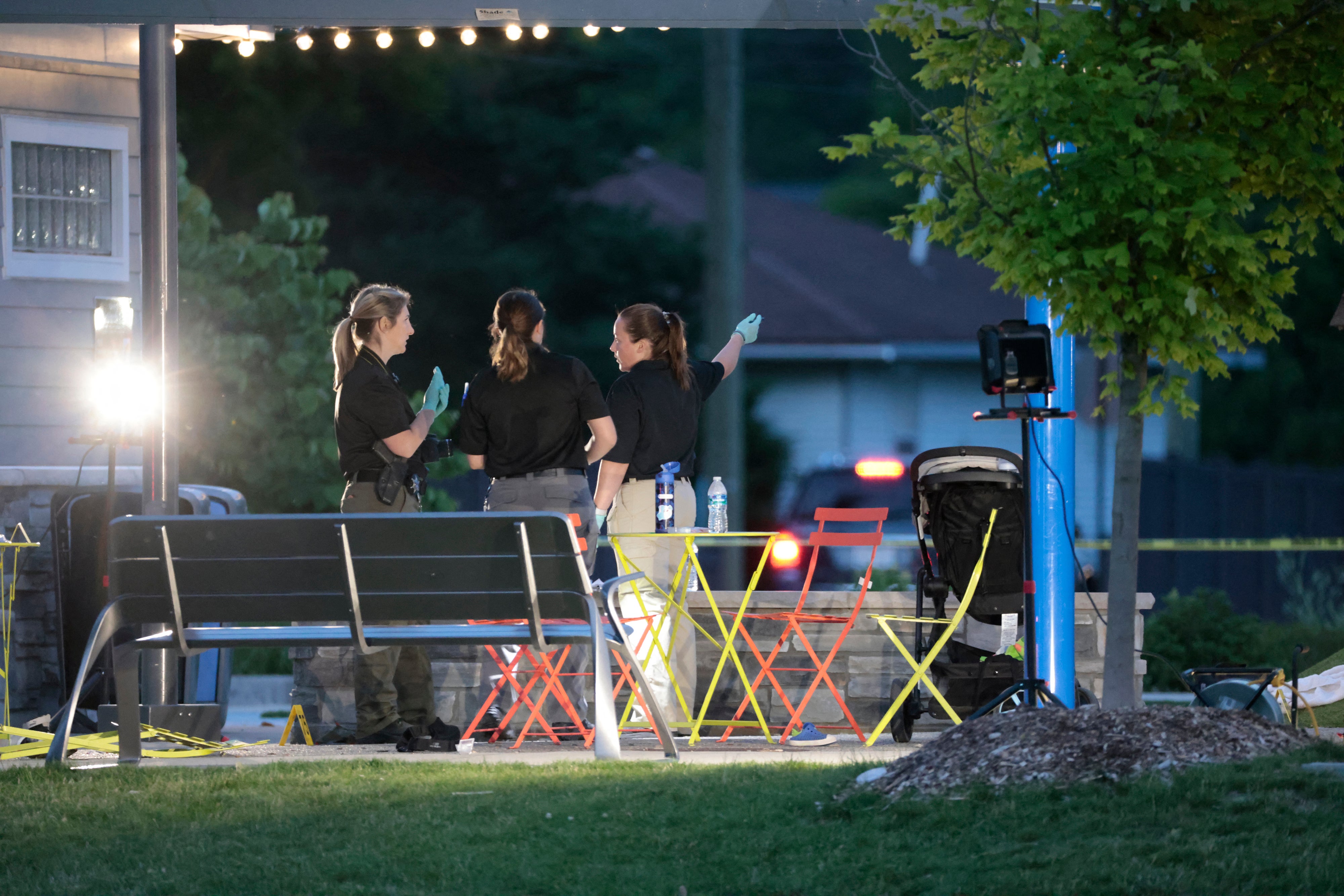 Police investigate the scene of a shooting at the Brooklands Plaza Splash Pad on June 15 in Rochester Hills, Michigan. Police have now identified the suspect as a 42-year-old man.