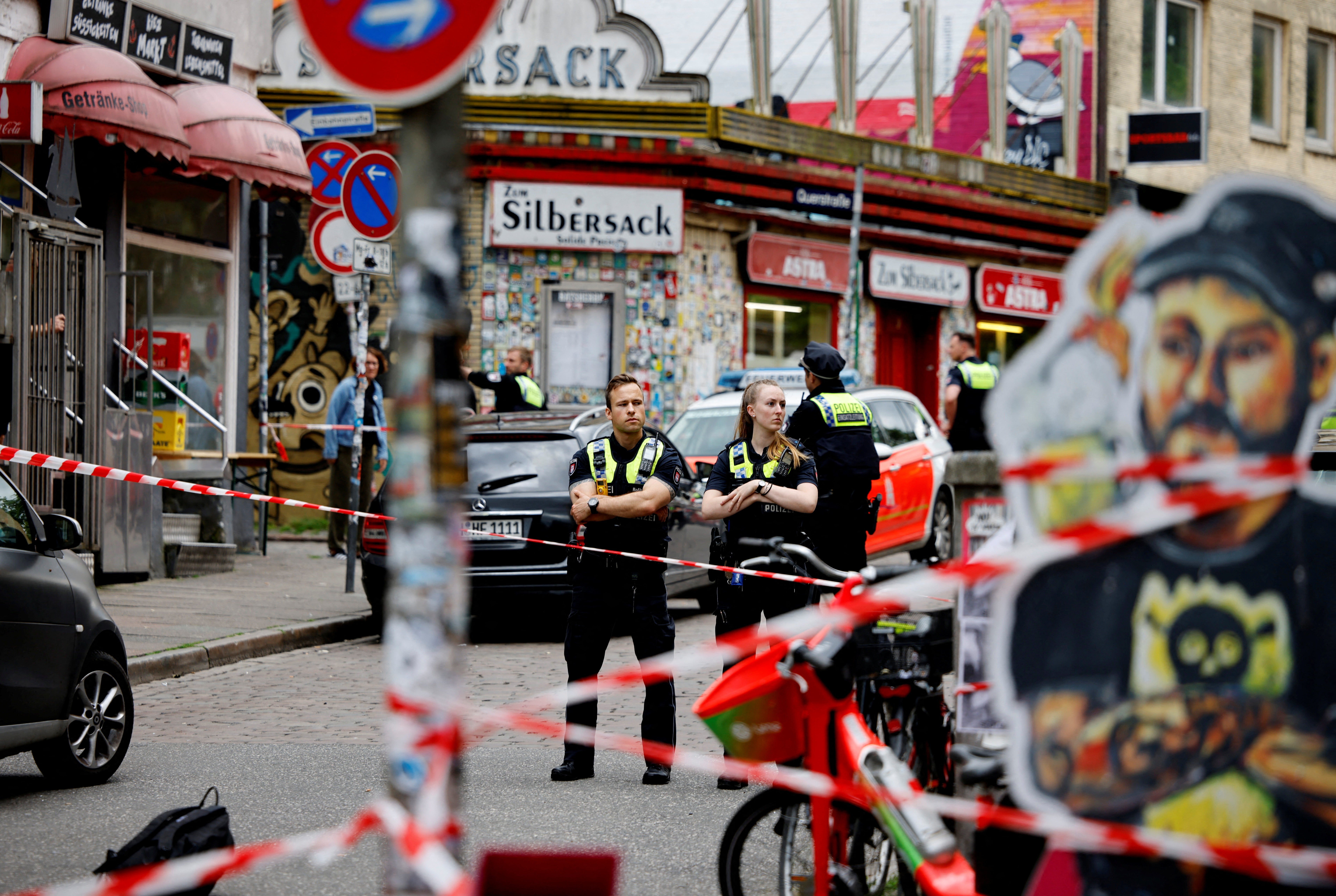 Police at the scene after a man was shot in the St Pauli district of Hamburg