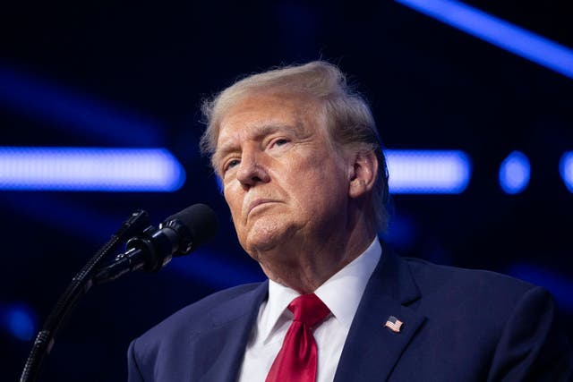 <p>Donald Trump speaks at a Turning Point USA conference on June 15. Now, crypto scammeras are going after his supporters with a new hoax. </p>