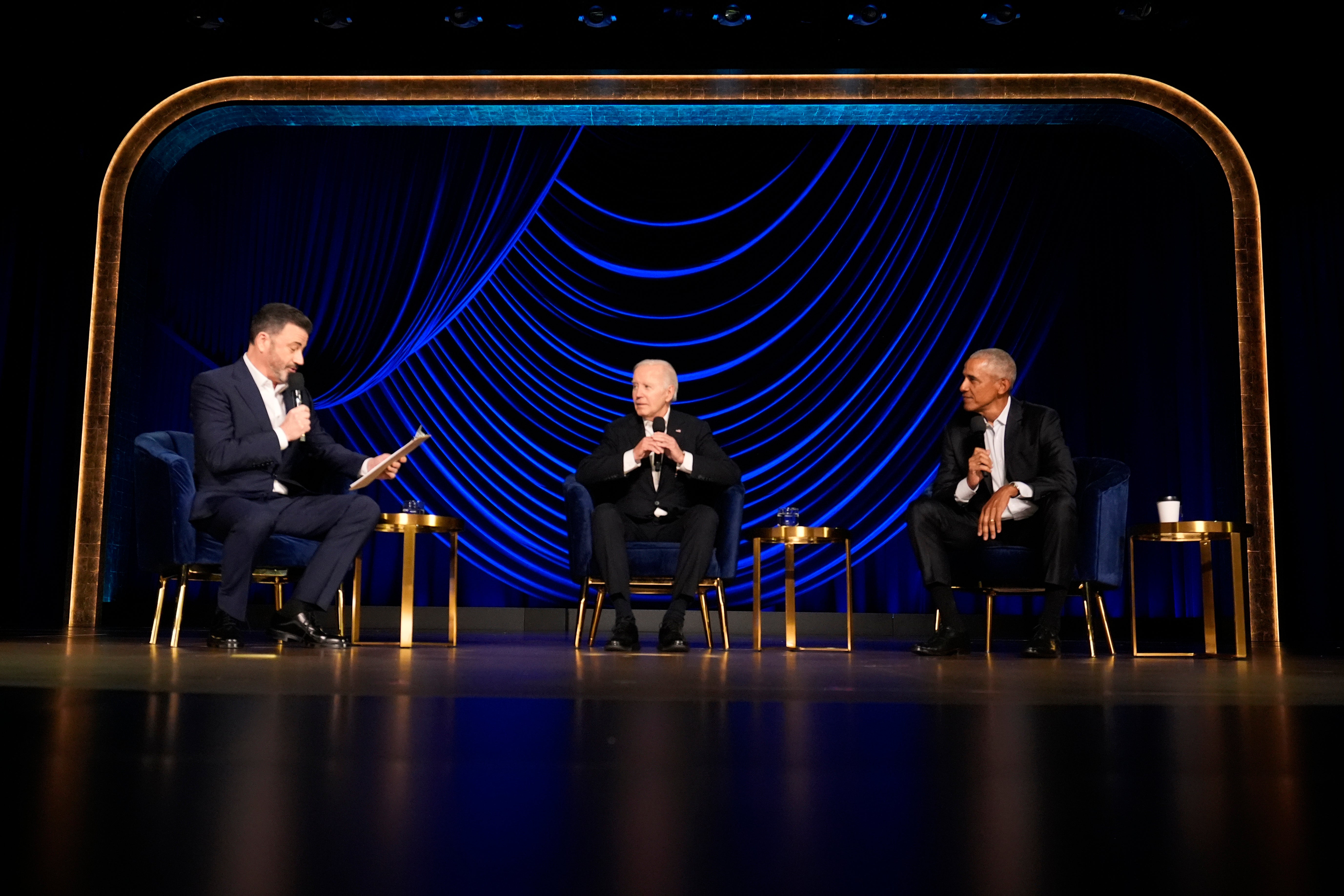 Jimmy Kimmel moderates a panel of President Joe Biden and former president Barack Obama at a fundraising event on Saturday in Los Angeles