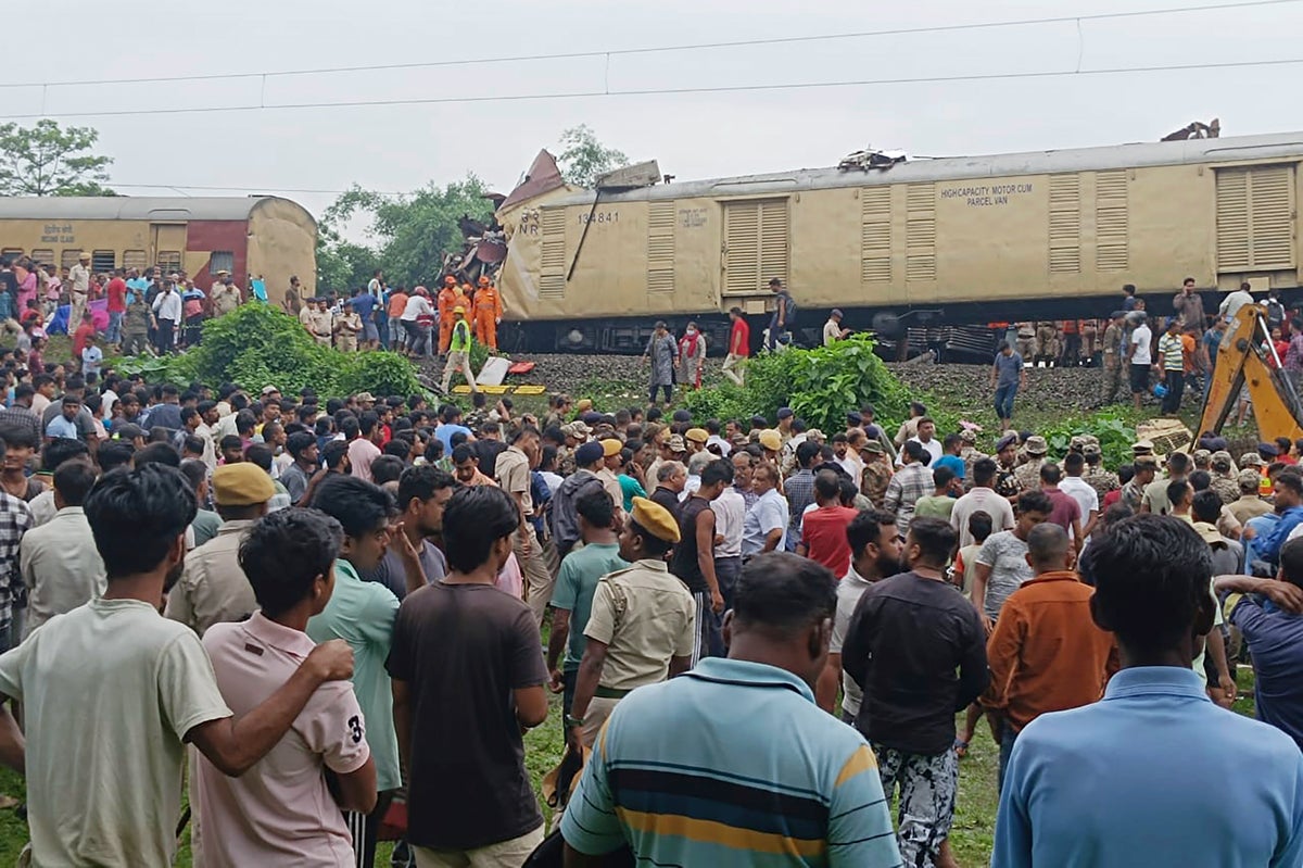 Rescuers search through wreckage after India train crash kills eight
