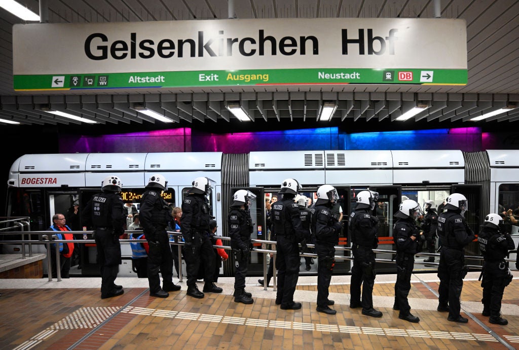 Riot police stand by the Hauptbahnhof main train station ahead of the England v Serbia Group C match