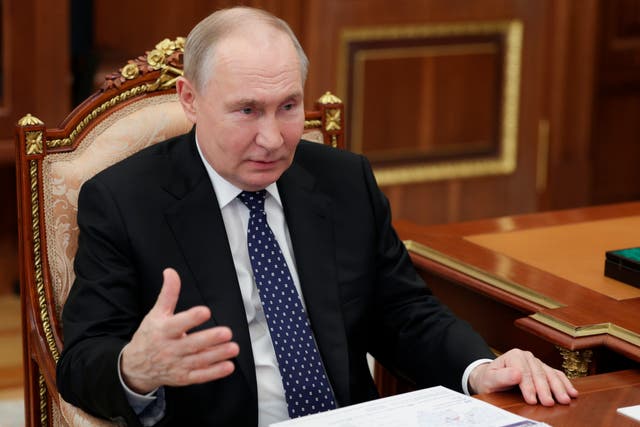 <p>Russian President Vladimir Putin gestures as he speaks to Moscow Region Governor Andrei Vorobyov at the Kremlin in Moscow</p>