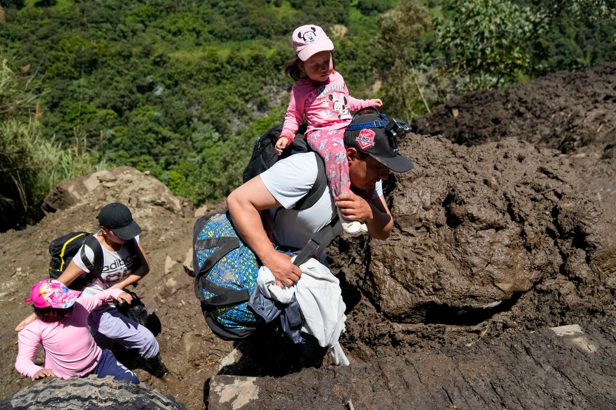 Heavy rains set off landslides in Ecuador, killing at least 6 and leaving dozens missing