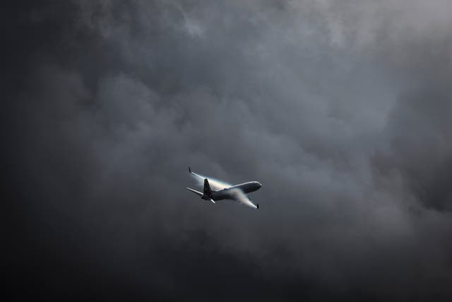 <p>A  Virgin Australia plane flies through a storm while approaching Sydney airport (file photo) </p>
