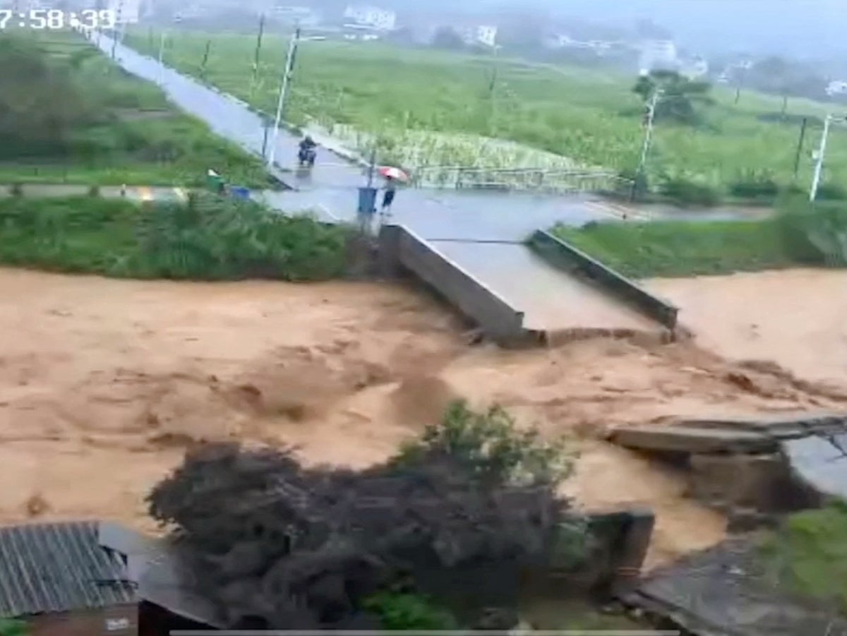 Floods and landslides kill nine in China’s south as drought hits north
